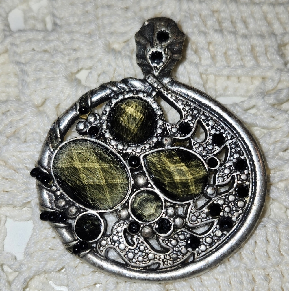 Lia Sophia "Bravado" necklace pendant. This retired design features a pewter-ton